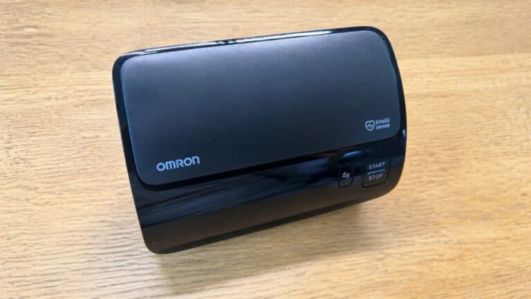 Omron Evolv wireless blood pressure monitor on a wooden table